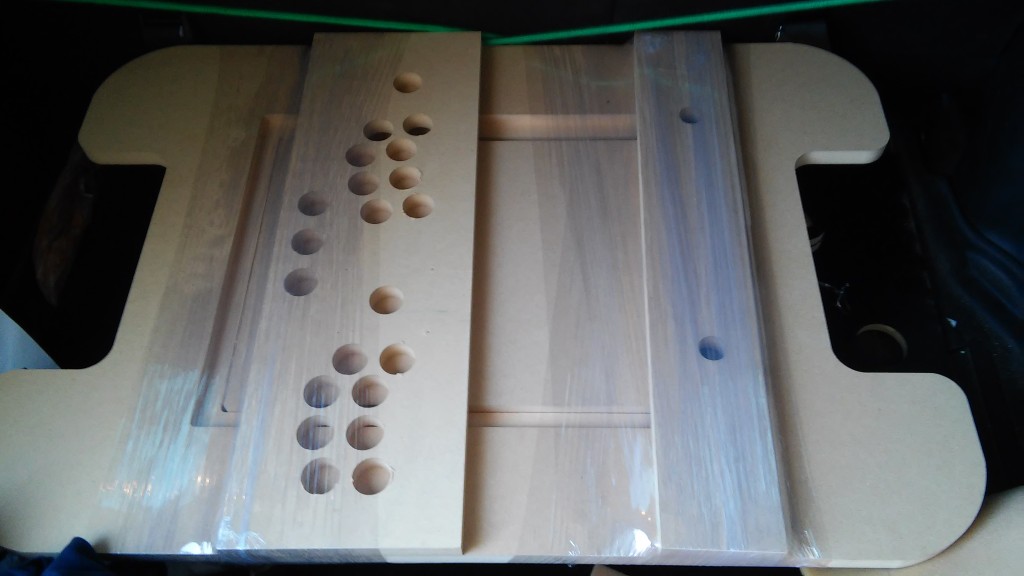 The first shot of some of the freshly CNC cut parts of the cabinet. These appear to be the MDF parts. 